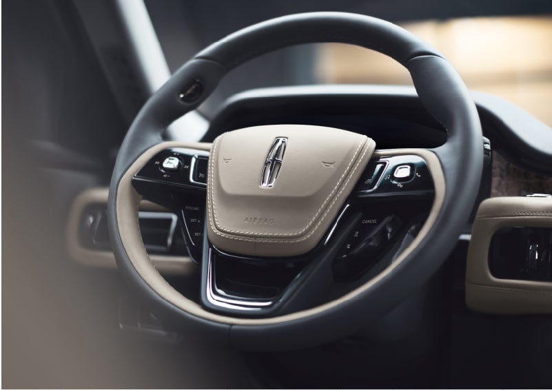 The intuitively placed controls of the steering wheel on a 2023 Lincoln Aviator® SUV | Baldwin Lincoln in Covington LA