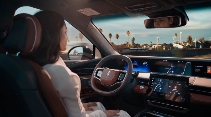 A person is shown driving hands-free on the highway with available Lincoln BlueCruise technology. | Baldwin Lincoln in Covington LA