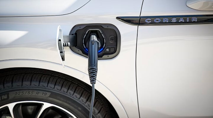 An electric charger is shown plugged into the charging port of a Lincoln Corsair® Grand Touring
model. | Baldwin Lincoln in Covington LA