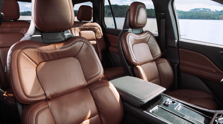 The front row's Perfect Position Seats in a 2024 Lincoln Aviator® Reserve model with Ebony Roast interior | Baldwin Lincoln in Covington LA
