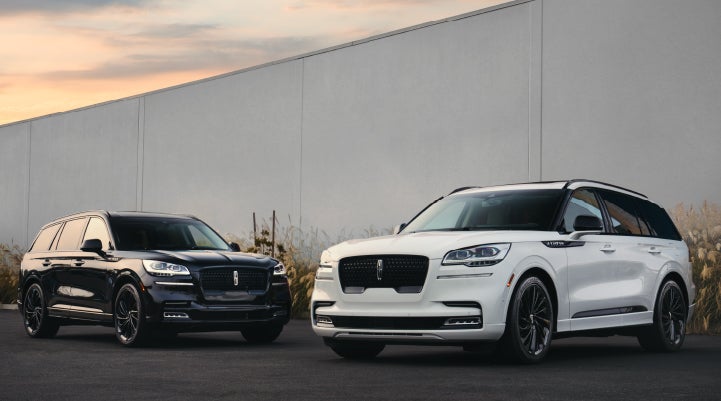 Two Lincoln Aviator® SUVs are shown with the available Jet Appearance Package | Baldwin Lincoln in Covington LA