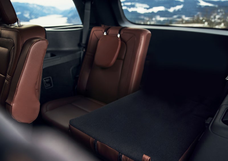 The left rear seat of a 2024 Lincoln Aviator® SUV is shown folded flat for additional cargo space | Baldwin Lincoln in Covington LA