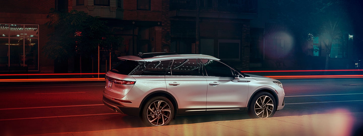 The 2024 Lincoln Corsair® SUV is parked on a city street at night. | Baldwin Lincoln in Covington LA